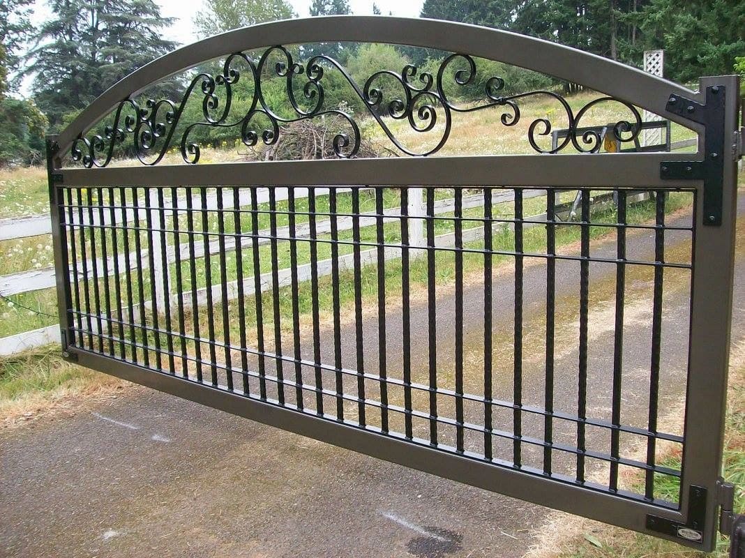 A gate that has some type of decorative design on it.