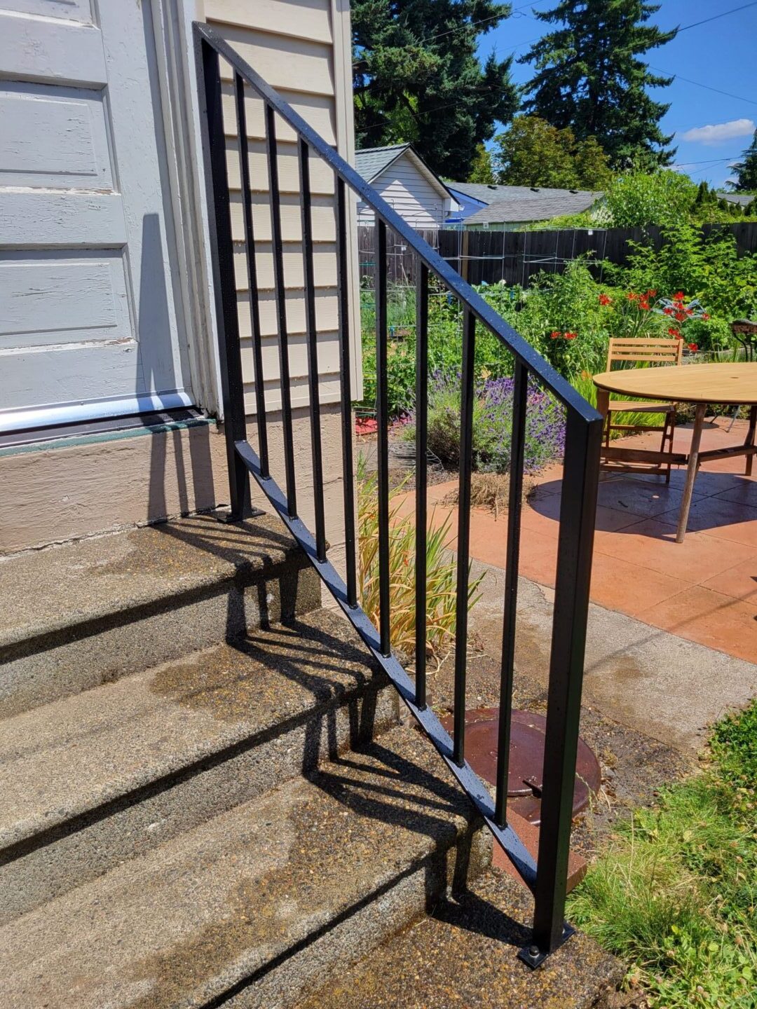 A metal railing on the side of steps.