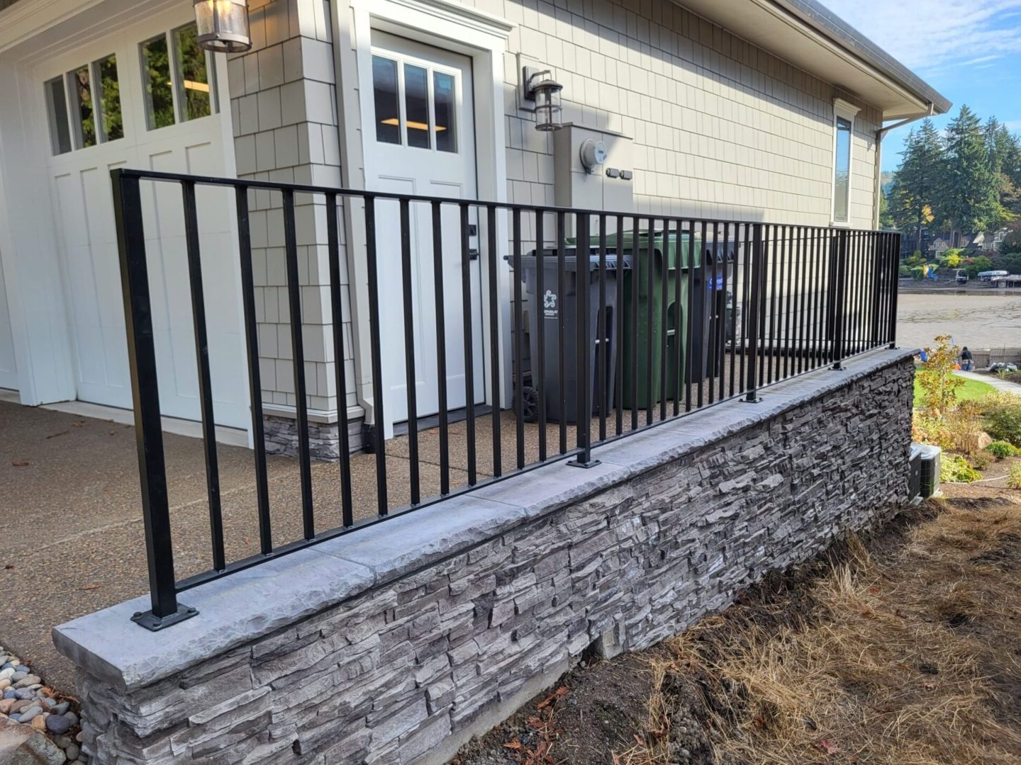 A fence that is made of metal and has bars.