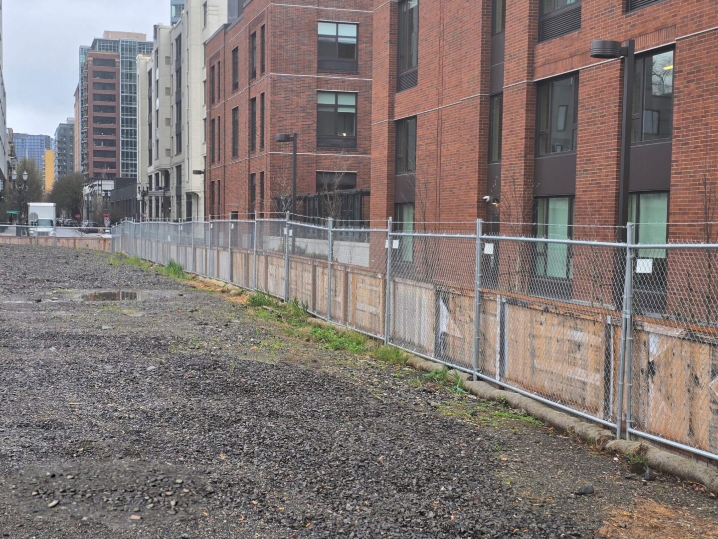 A fence that is next to some buildings