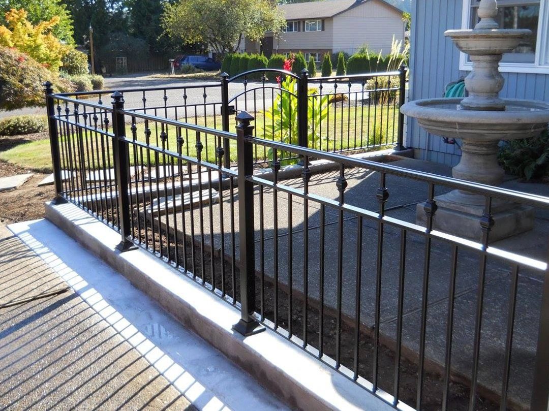 A fence that is made of metal.