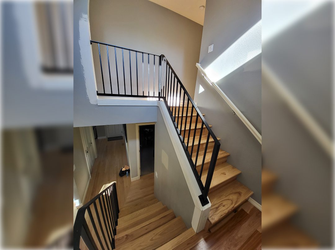 A view of stairs from the top floor.